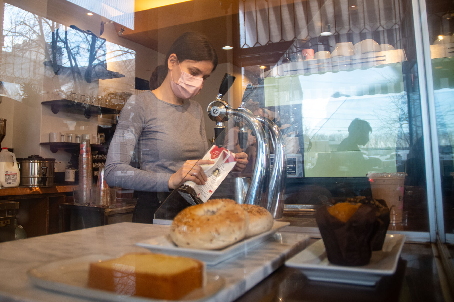 Christine Hughes makes drink at Elixr Coffee Roasters